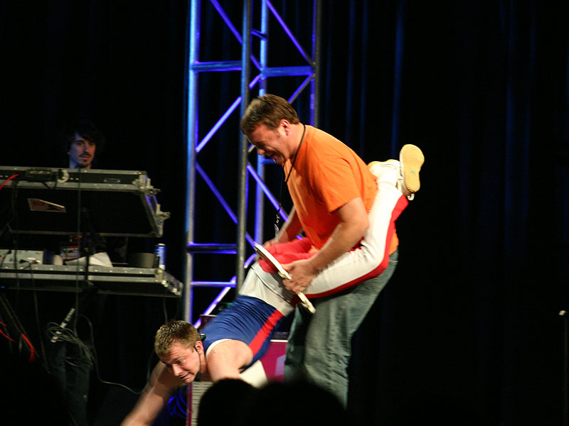 Why go to QuakeCon?  So you can see a guy trying to pull another guy through a toilet seat, of course!